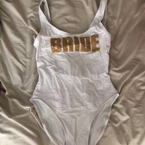 One piece “Bride” bikini. White with gold writing